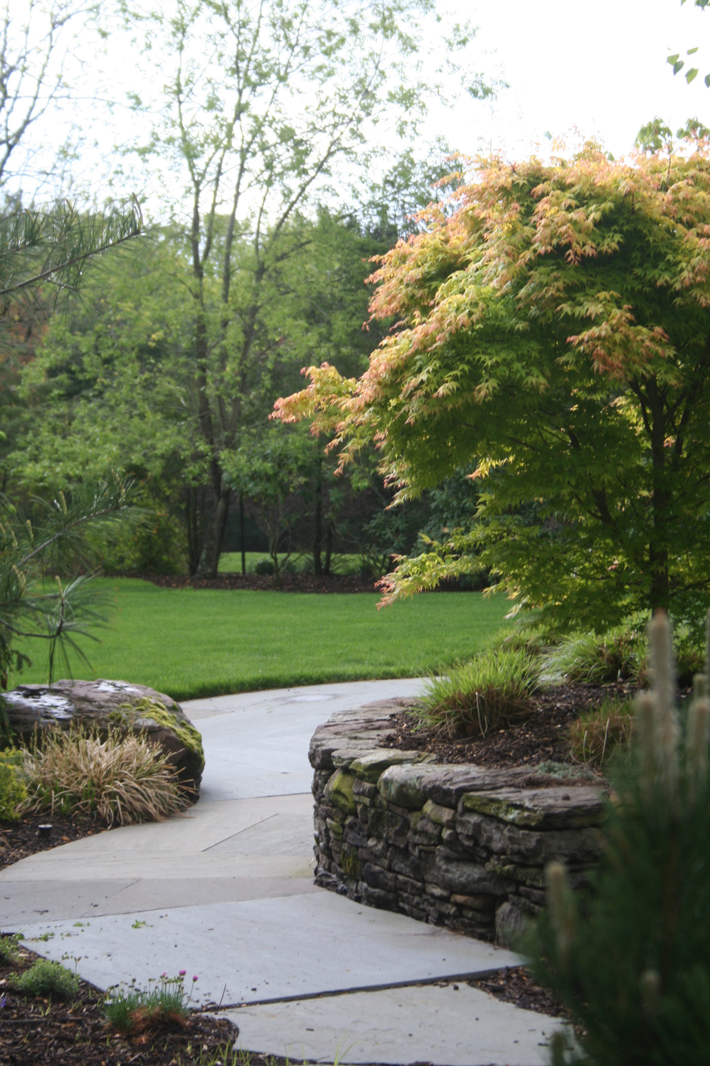 Natural Stone Retaining Wall by Cording Landscape Design