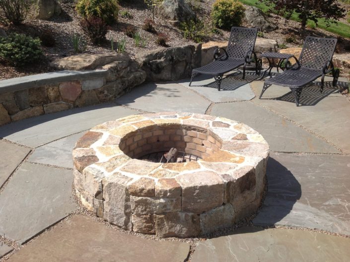 Outdoor Stone Firepit by Cording Landscape Design